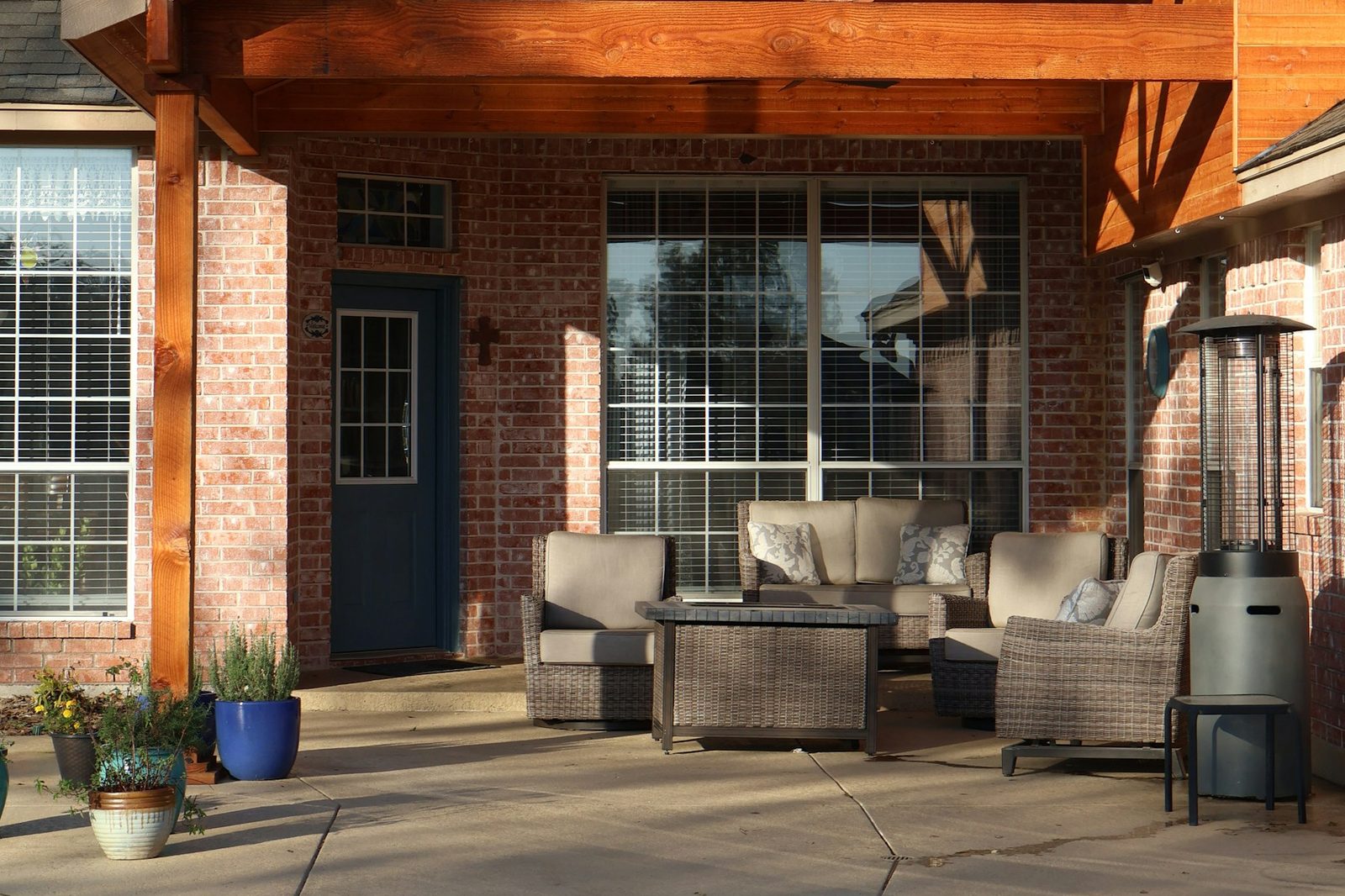 Home exterior with a wraparound covered porch